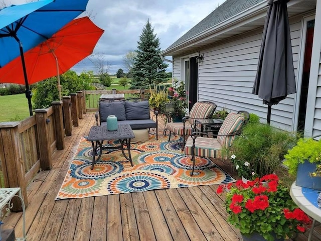 wooden deck with an outdoor hangout area