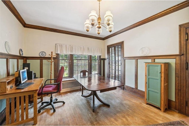 office with a notable chandelier, ornamental molding, and light wood-type flooring