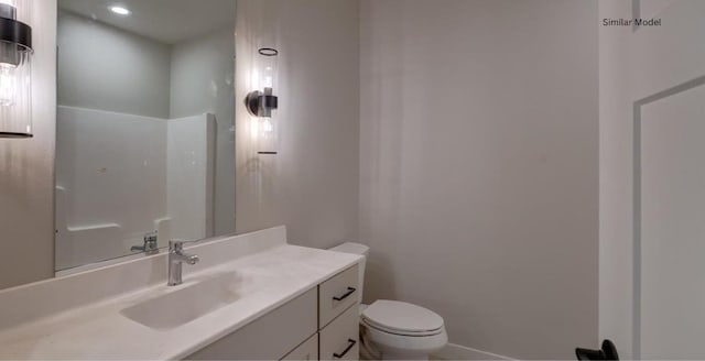 bathroom with toilet and vanity