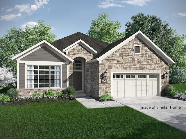 view of front of property with a garage and a front yard