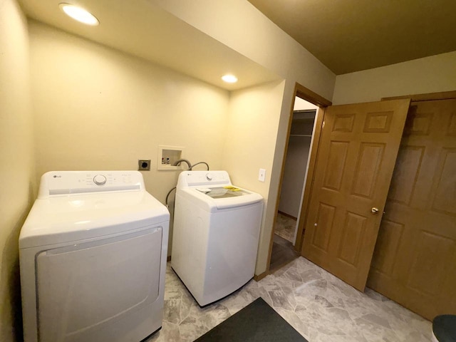 laundry area featuring separate washer and dryer