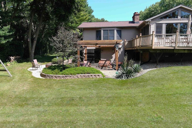 back of house with a deck, a yard, a patio area, and a pergola