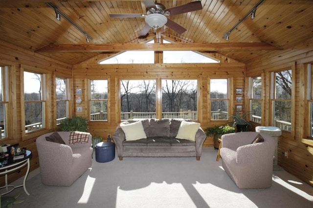 sunroom / solarium featuring track lighting, wooden ceiling, and lofted ceiling with beams