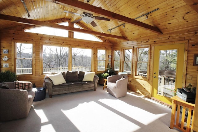 sunroom featuring vaulted ceiling with beams, wooden ceiling, rail lighting, and ceiling fan