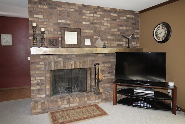 living room featuring crown molding, carpet floors, and a brick fireplace