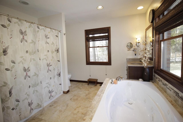 full bathroom featuring vanity, shower with separate bathtub, and toilet