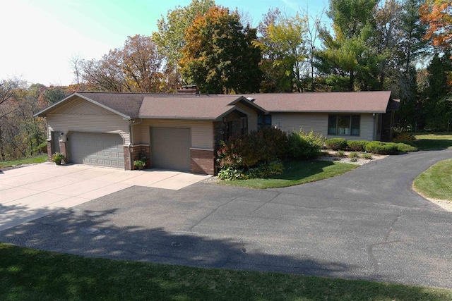 ranch-style home featuring a garage