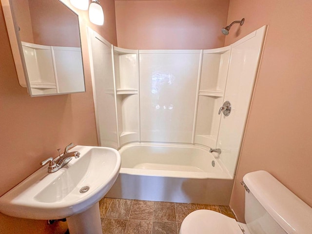 full bathroom featuring tub / shower combination, sink, and toilet