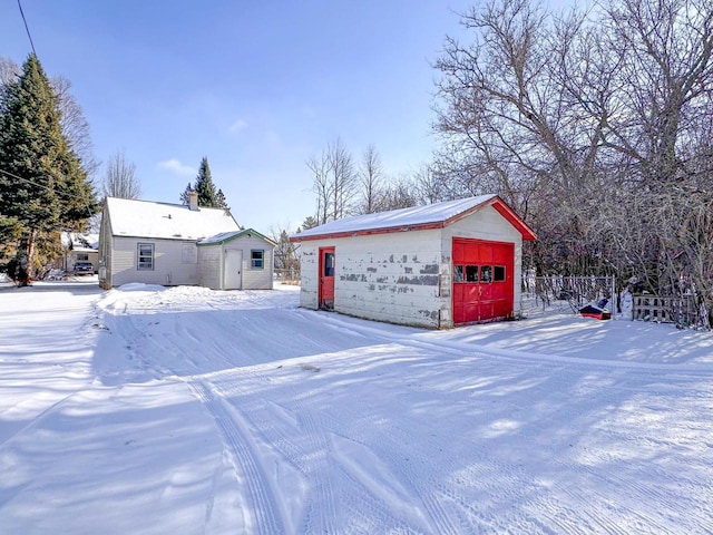 exterior space with a garage and an outdoor structure