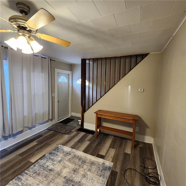 foyer featuring dark wood-type flooring and ceiling fan