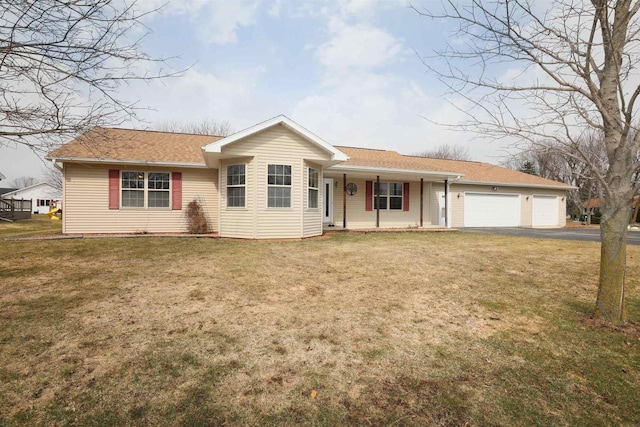 ranch-style home featuring a garage and a front yard