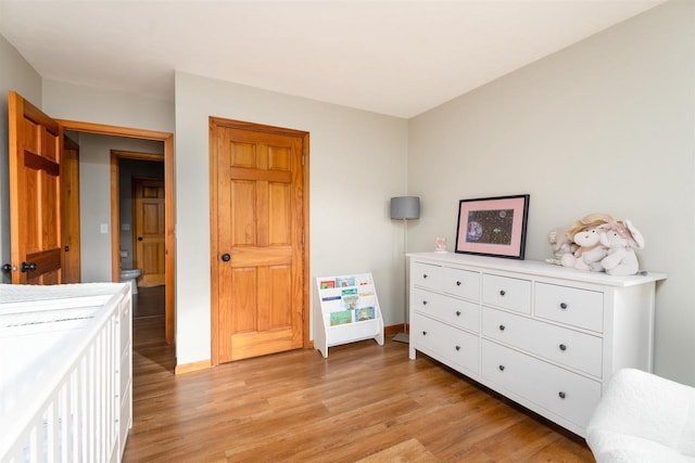 bedroom with light wood-type flooring