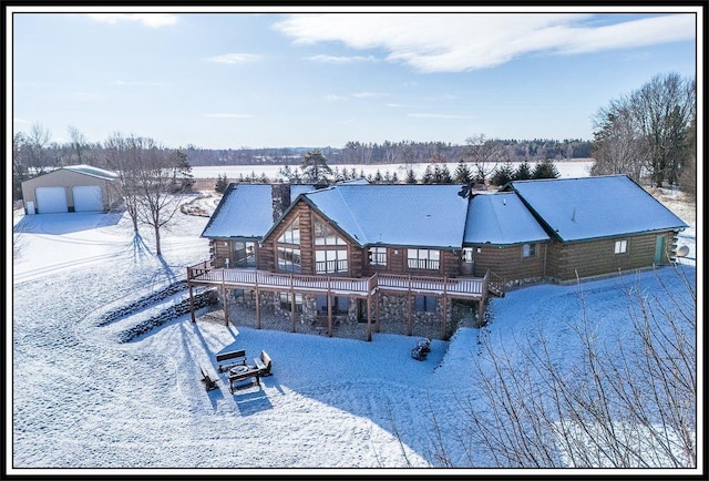 snow covered pool featuring a deck