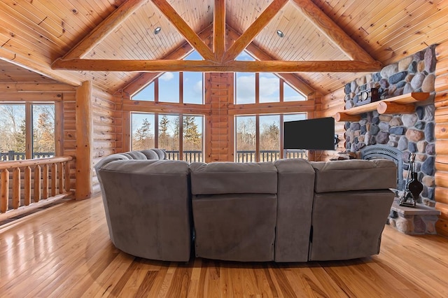 living room featuring wood ceiling, rustic walls, high vaulted ceiling, and light hardwood / wood-style flooring