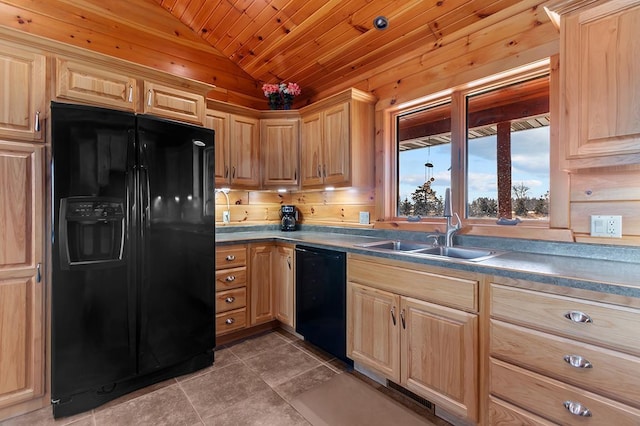 kitchen featuring light brown cabinetry, sink, vaulted ceiling, dark tile patterned floors, and black appliances