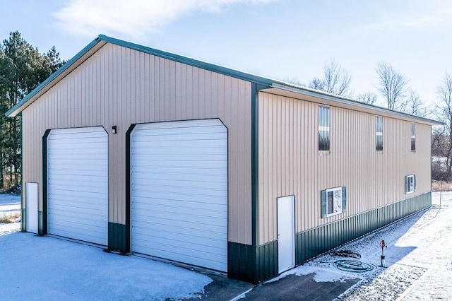 view of snow covered garage