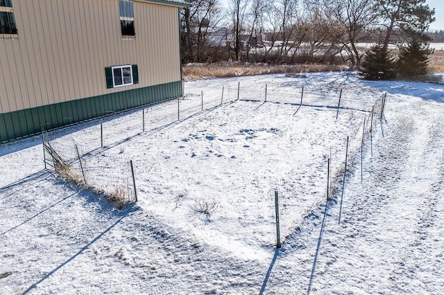 view of yard layered in snow