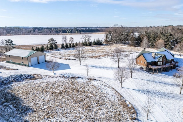 snowy aerial view featuring a rural view