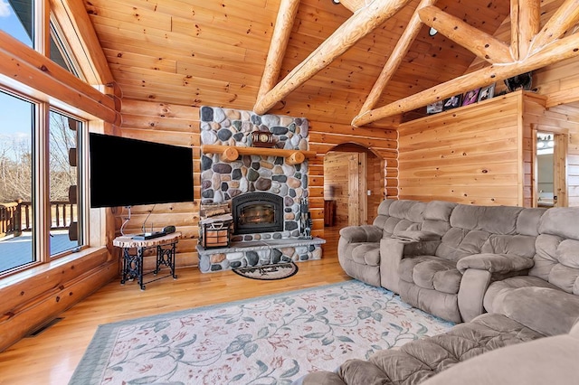 living room with wood ceiling, hardwood / wood-style flooring, beam ceiling, high vaulted ceiling, and a wealth of natural light