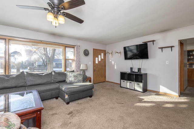 carpeted living room featuring ceiling fan