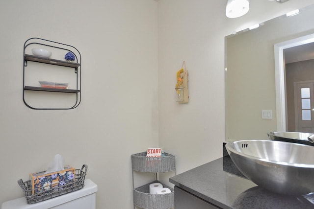 bathroom with vanity and toilet