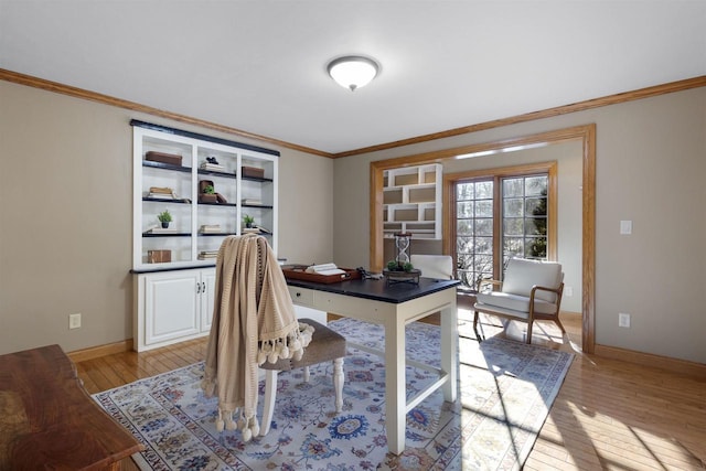 home office featuring crown molding and light hardwood / wood-style floors