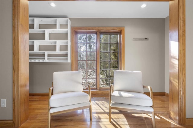 sitting room with light hardwood / wood-style flooring