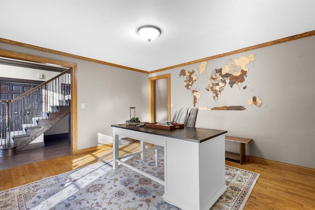 office area featuring crown molding and light hardwood / wood-style flooring