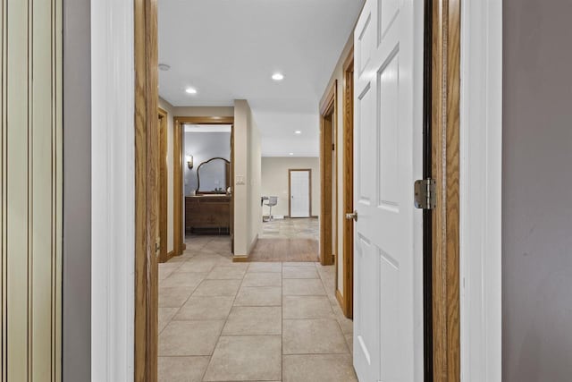 hallway featuring light tile patterned floors