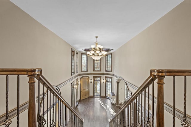 interior space with hardwood / wood-style flooring and a notable chandelier