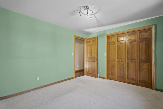 unfurnished bedroom with carpet floors and a closet