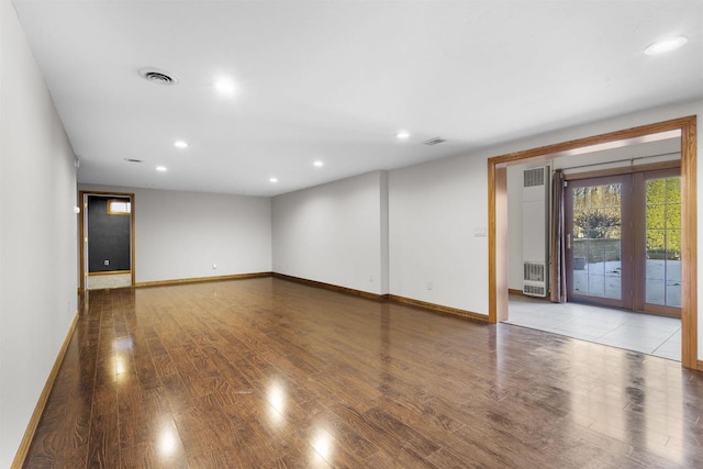 empty room with wood-type flooring