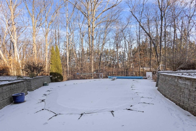 view of yard layered in snow