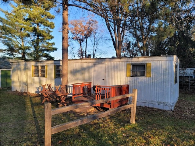 exterior space with a yard and a deck