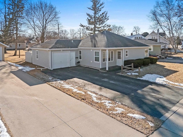 ranch-style home with a garage