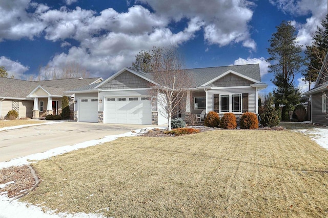 craftsman-style home with a garage and a front yard