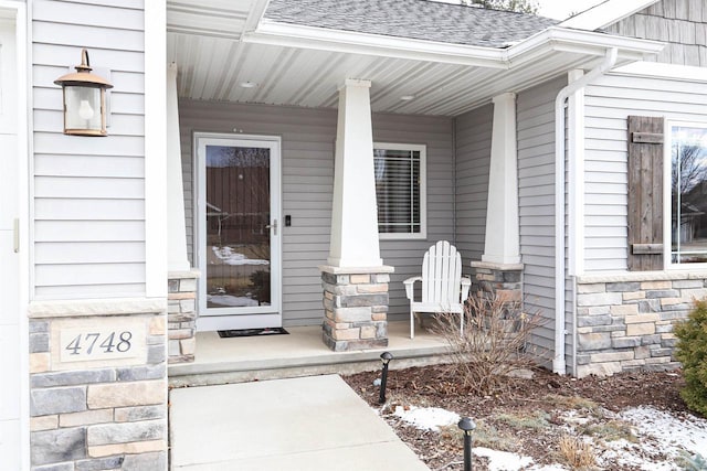 property entrance with covered porch