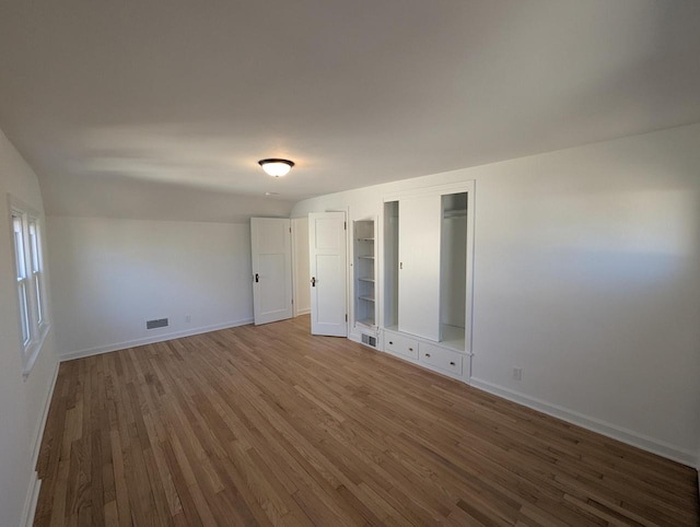 empty room with wood-type flooring