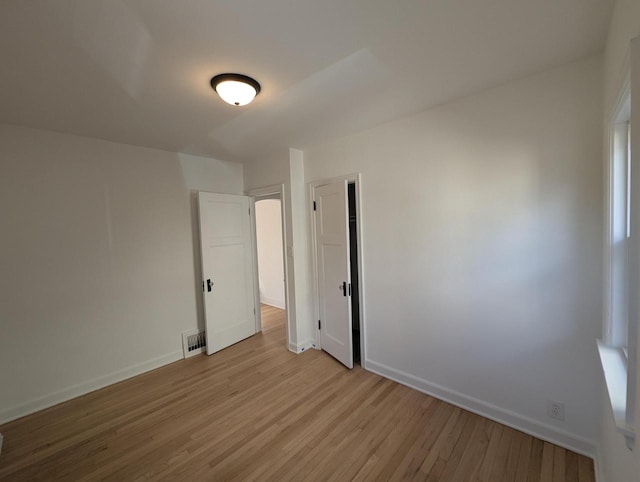 unfurnished room featuring light hardwood / wood-style flooring