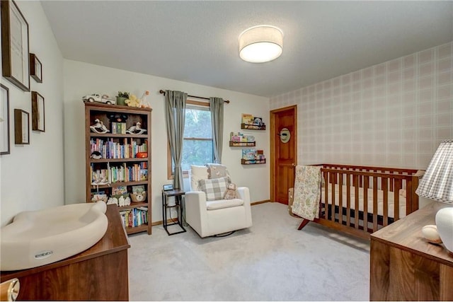 carpeted bedroom with a crib