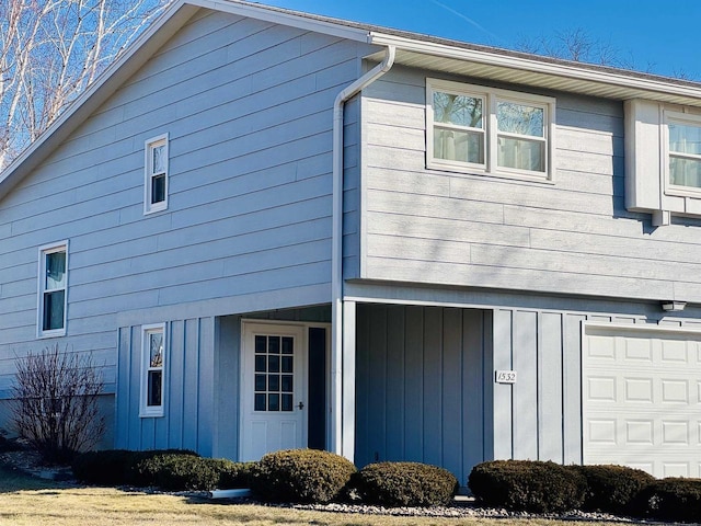 view of property exterior with a garage