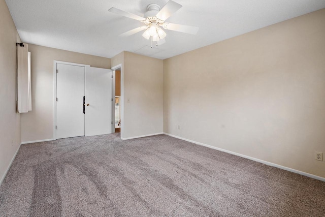 unfurnished bedroom featuring carpet floors and ceiling fan