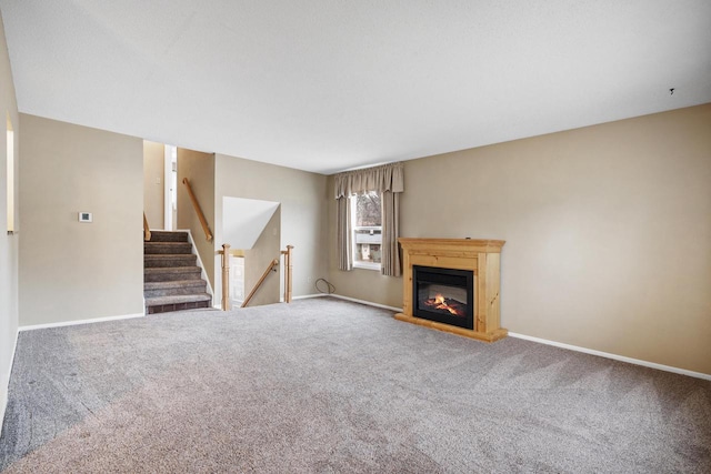 unfurnished living room featuring carpet flooring