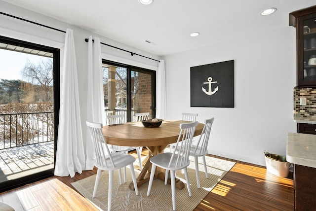 dining room with wood-type flooring