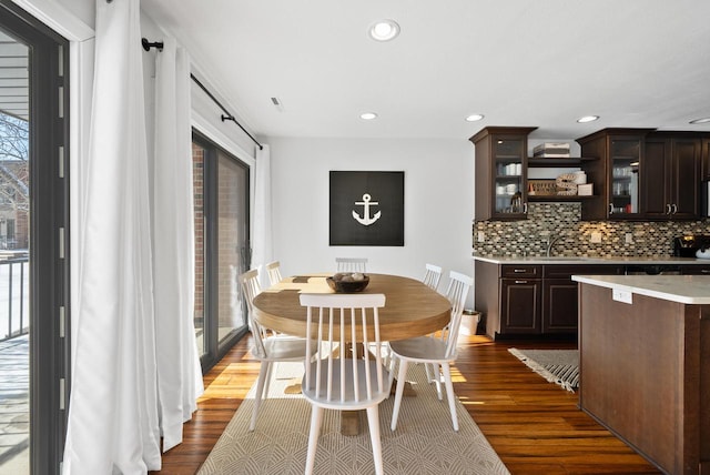 dining room featuring dark hardwood / wood-style floors and sink