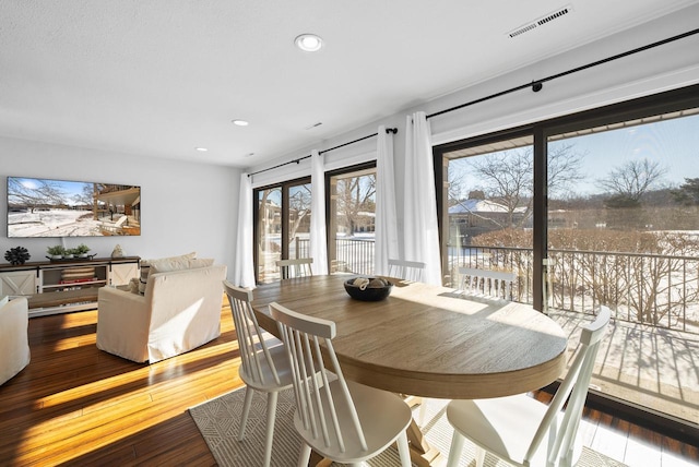 dining space featuring hardwood / wood-style flooring