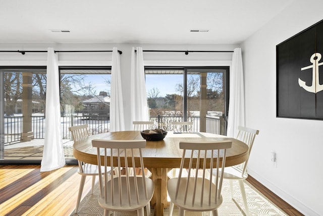 dining area with light wood-type flooring