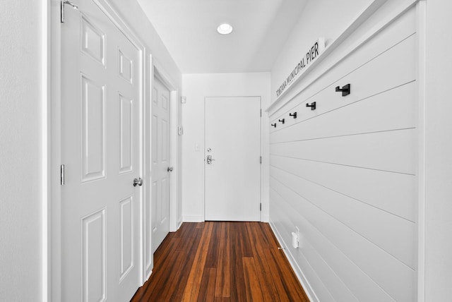 hall with dark wood-type flooring