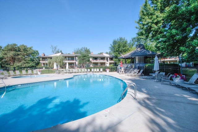 view of swimming pool featuring a gazebo and a patio area