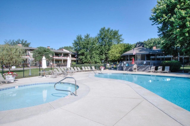 view of swimming pool featuring a gazebo and a patio area